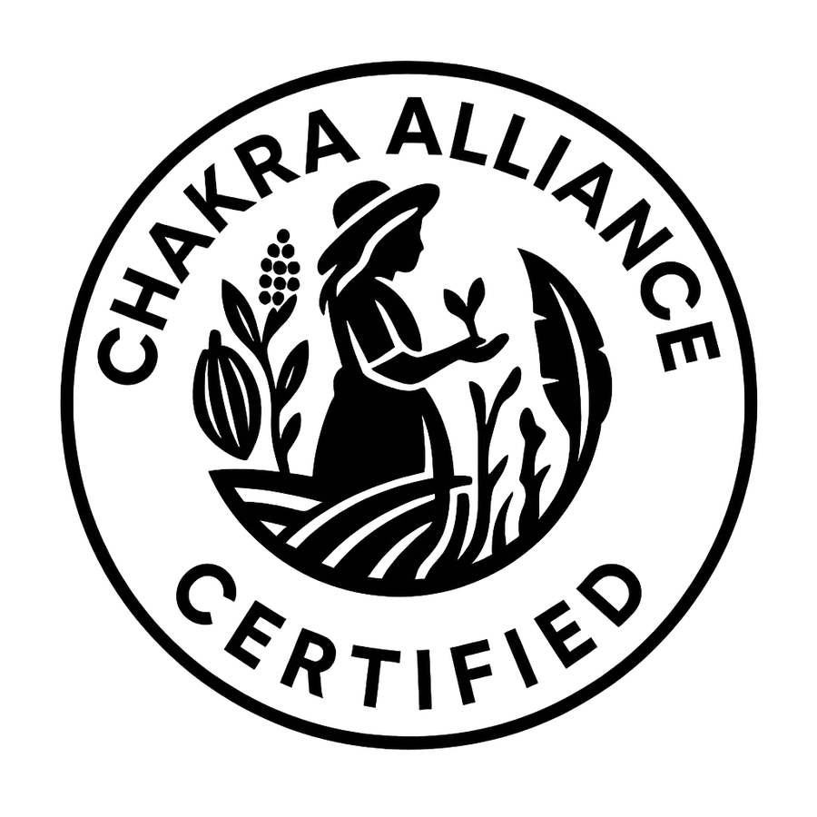 Chakra Alliance Certified emblem: a woman tending cacao, guayusa and native plants inside a circular seal